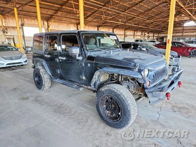 Czwarte zdjęcie samochodu z boku: 2011 JEEP WRANGLER UNLIMITED SPORT VIN:1J4BA3H12BL568461 - miniatura