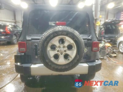 Zdjęcie 6 z 11 samochodu: 2014 JEEP WRANGLER UNLIMITED SAHARA VIN:1C4HJWEG0EL174181 - miniatura