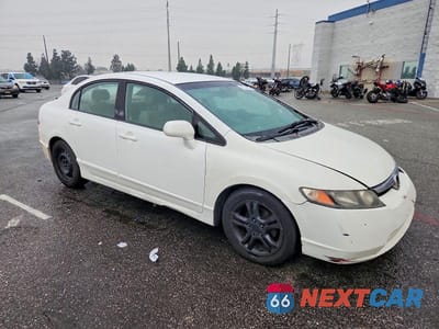 Czwarte zdjęcie samochodu z boku: 2009 HONDA CIVIC LX VIN:2HGFA16579H329384 - miniatura