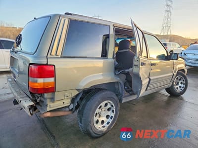 Trzecie zdjęcie samochodu z tyłu: 1995 JEEP GRAND CHEROKEE LAREDO VIN:1J4GZ58S2SC571119 - miniatura