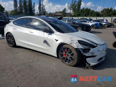 Czwarte zdjęcie samochodu z boku: 2022 TESLA MODEL 3 VIN:5YJ3E1EB7NF172839 - miniatura