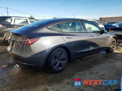 Trzecie zdjęcie samochodu z tyłu: 2023 TESLA MODEL 3 VIN:5YJ3E1EA3PF699223 - miniatura