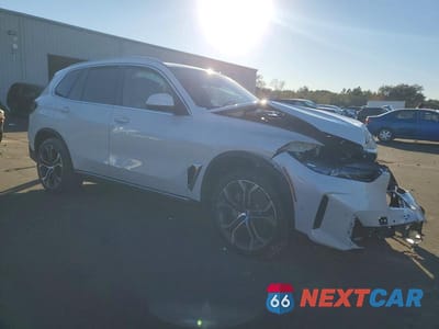 Czwarte zdjęcie samochodu z boku: 2026 BMW X5 XDRIVE40I VIN:5UX23EU09T9265991 - miniatura