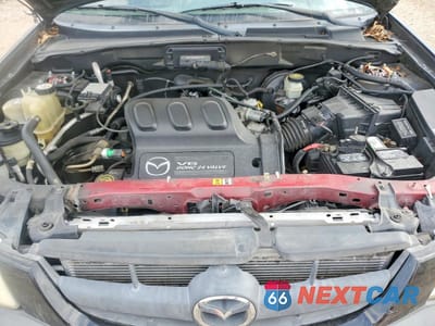 Zdjęcie 11 z 13 samochodu: 2002 MAZDA TRIBUTE LX VIN:4F2YU09142KM31418 - miniatura