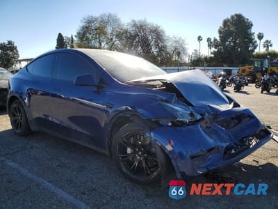 Czwarte zdjęcie samochodu z boku: 2022 TESLA MODEL Y VIN:7SAYGDEE6NF561843 - miniatura