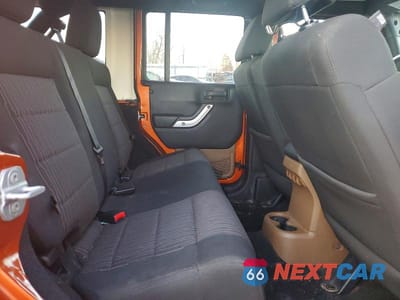 Zdjęcie 11 z 12 samochodu: 2011 JEEP WRANGLER UNLIMITED SAHARA VIN:1J4HA5H1XBL572649 - miniatura