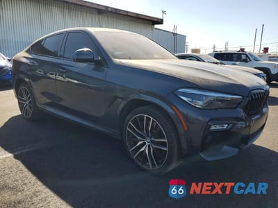 Czwarte zdjęcie samochodu z boku: 2021 BMW X6 M50I VIN:5UXCY8C09M9E39040 - miniatura