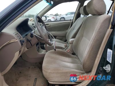 Zdjęcie 7 z 11 samochodu: 2001 TOYOTA COROLLA LE VIN:2T1BR12E01C465897 - miniatura