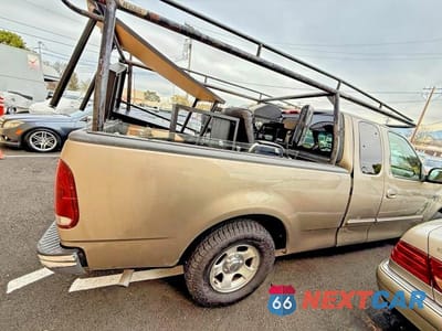 Czwarte zdjęcie samochodu z boku: 2001 FORD F150 VIN:1FTRX17L81NA76272 - miniatura