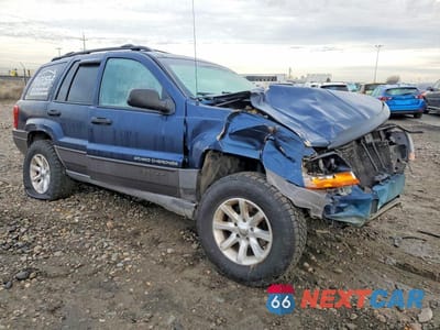 Czwarte zdjęcie samochodu z boku: 2000 JEEP GRAND CHEROKEE LAREDO VIN:1J4GW48S8YC211039 - miniatura