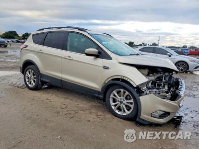 Czwarte zdjęcie samochodu z boku: 2017 FORD ESCAPE SE VIN:1FMCU9G92HUB24376 - miniatura