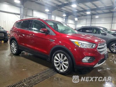 Czwarte zdjęcie samochodu z boku: 2017 FORD ESCAPE TITANIUM VIN:1FMCU9J92HUB62618 - miniatura