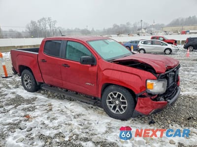Czwarte zdjęcie samochodu z boku: 2021 GMC CANYON AT4 VIN:1GTG6FEN5M1116377 - miniatura
