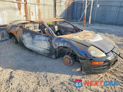 Czwarte zdjęcie samochodu z boku: 2002 MITSUBISHI ECLIPSE SPYDER GT VIN:4A3AE85H72E054210 - miniatura