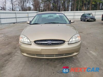 Piąte zdjęcie samochodu w środku: 2000 FORD TAURUS LX VIN:1FAFP53U3YA232203 - miniatura