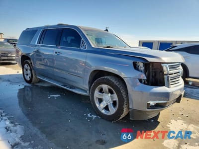 Czwarte zdjęcie samochodu z boku: 2015 CHEVROLET SUBURBAN K1500 LTZ VIN:1GNSKKKC5FR730682 - miniatura