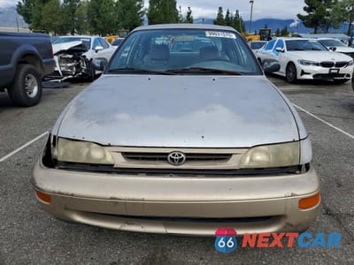 Piąte zdjęcie samochodu w środku: 1997 TOYOTA COROLLA BASE VIN:1NXBA02E1VZ649994 - miniatura