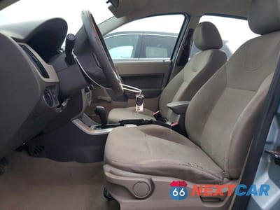 Zdjęcie 7 z 11 samochodu: 2009 FORD FOCUS S VIN:1FAHP34N09W231325 - miniatura