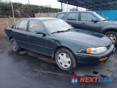 Czwarte zdjęcie samochodu z boku: 1995 TOYOTA CAMRY LE VIN:JT2GK12E1S0124877 - miniatura