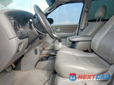 Zdjęcie 7 z 13 samochodu: 2002 MAZDA TRIBUTE LX VIN:4F2YU09142KM31418 - miniatura