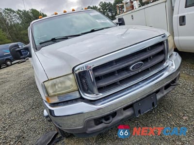 Czwarte zdjęcie samochodu z boku: 2002 FORD F350 SUPER DUTY VIN:1FTWW32F92EA26422 - miniatura