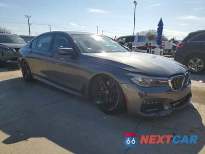 Czwarte zdjęcie samochodu z boku: 2016 BMW 740 I VIN:WBA7E2C57GG547607 - miniatura