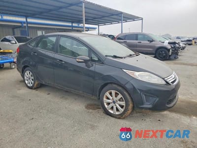 Czwarte zdjęcie samochodu z boku: 2013 FORD FIESTA SE VIN:3FADP4BJXDM223231 - miniatura