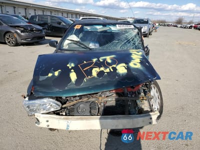 Piąte zdjęcie samochodu w środku: 1995 TOYOTA COROLLA LE VIN:1NXAE09B2SZ337559 - miniatura