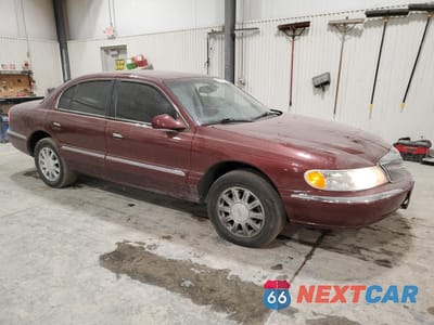 Czwarte zdjęcie samochodu z boku: 2002 LINCOLN CONTINENTAL VIN:1LNHM97V42Y687688 - miniatura