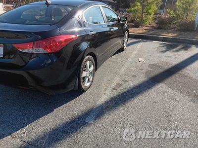 Czwarte zdjęcie samochodu z boku: 2013 HYUNDAI ELANTRA GLS VIN:KMHDH4AE5DU602673 - miniatura