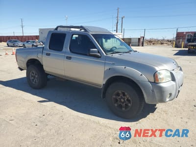 Czwarte zdjęcie samochodu z boku: 2001 NISSAN FRONTIER CREW CAB XE VIN:1N6ED27TX1C385649 - miniatura