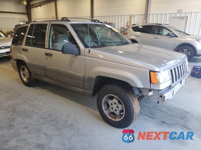 Czwarte zdjęcie samochodu z boku: 1997 JEEP GRAND CHEROKEE LAREDO VIN:1J4FX58S0VC770823 - miniatura