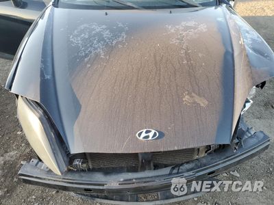 Zdjęcie 11 z 12 samochodu: 2005 HYUNDAI TIBURON VIN:KMHHM65D25U176369 - miniatura