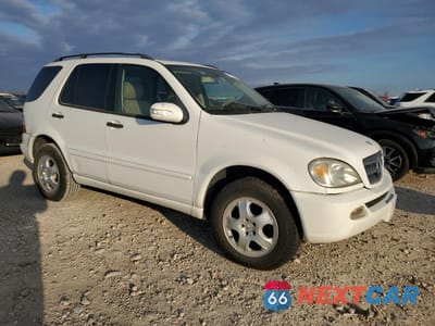 Czwarte zdjęcie samochodu z boku: 2003 MERCEDES-BENZ ML 350 VIN:4JGAB57E93A420668 - miniatura