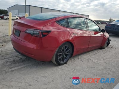 Trzecie zdjęcie samochodu z tyłu: 2023 TESLA MODEL 3 VIN:5YJ3E1EA1PF591196 - miniatura