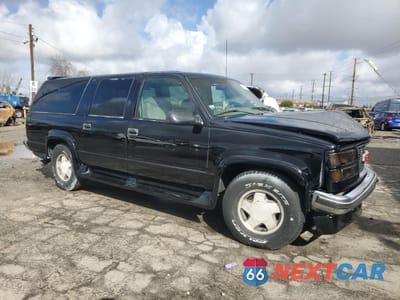 Czwarte zdjęcie samochodu z boku: 1996 GMC SUBURBAN K1500 VIN:1GDFK16R3TJ749952 - miniatura