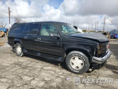 Czwarte zdjęcie samochodu z boku: 1996 GMC SUBURBAN K1500 VIN:1GDFK16R3TJ749952 - miniatura