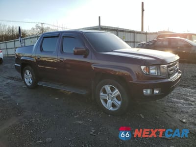 Czwarte zdjęcie samochodu z boku: 2010 HONDA RIDGELINE RTL VIN:5FPYK1F54AB003869 - miniatura