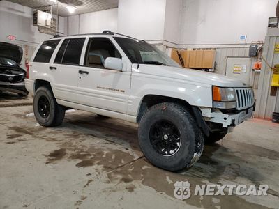 Czwarte zdjęcie samochodu z boku: 1997 JEEP GRAND CHEROKEE LIMITED VIN:1J4GZ78Y5VC747553 - miniatura