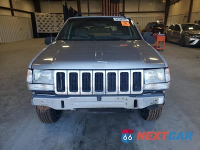 Piąte zdjęcie samochodu w środku: 1997 JEEP GRAND CHEROKEE LAREDO VIN:1J4FX58S0VC770823 - miniatura