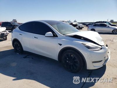 Czwarte zdjęcie samochodu z boku: 2023 TESLA MODEL Y VIN:7SAYGAEE0PF686760 - miniatura