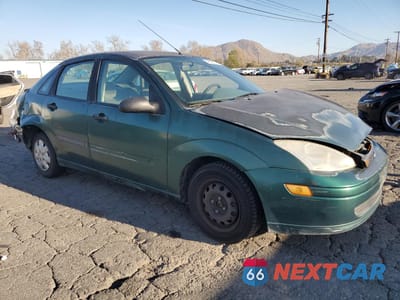 Czwarte zdjęcie samochodu z boku: 2000 FORD FOCUS LX VIN:1FAFP33P3YW215712 - miniatura