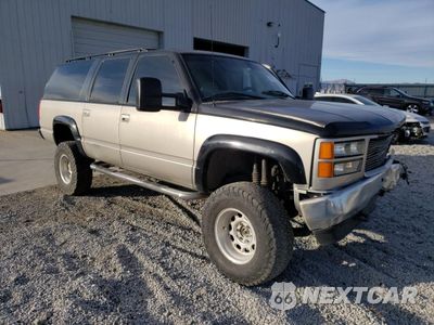 Czwarte zdjęcie samochodu z boku: 1999 GMC SUBURBAN K1500 VIN:1GDFK16R6XJ778691 - miniatura