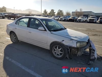 Czwarte zdjęcie samochodu z boku: 2002 HYUNDAI ELANTRA GLS VIN:KMHDN45DX2U341791 - miniatura