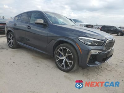 Czwarte zdjęcie samochodu z boku: 2020 BMW X6 M50I VIN:5UXCY8C08L9B12708 - miniatura