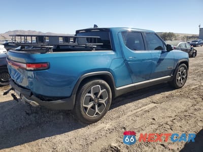 Trzecie zdjęcie samochodu z tyłu: 2023 RIVIAN R1T ADVENTURE VIN:7FCTGAAA0PN021721 - miniatura