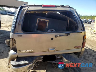 Zdjęcie 6 z 11 samochodu: 2001 GMC YUKON VIN:1GKEC13VX1J309274 - miniatura