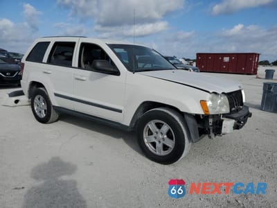 Czwarte zdjęcie samochodu z boku: 2007 JEEP GRAND CHEROKEE LAREDO VIN:1J8HS48P67C625235 - miniatura