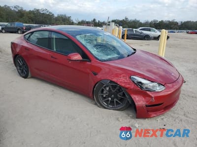 Czwarte zdjęcie samochodu z boku: 2023 TESLA MODEL 3 VIN:5YJ3E1EA1PF591196 - miniatura