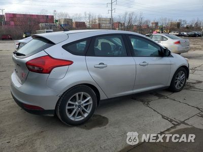 Trzecie zdjęcie samochodu z tyłu: 2017 FORD FOCUS SE VIN:1FADP3K26HL309243 - miniatura
